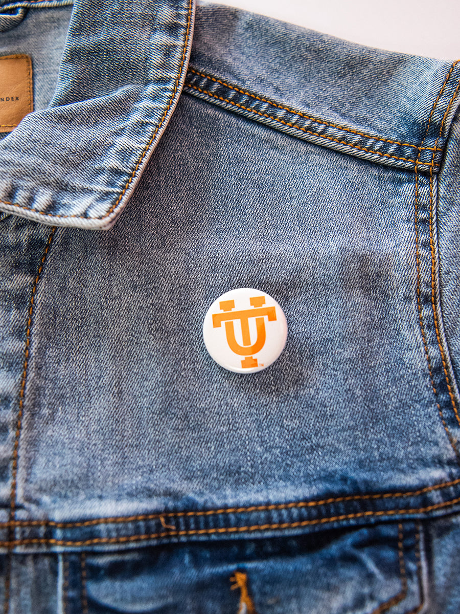 White button with orange UT logo