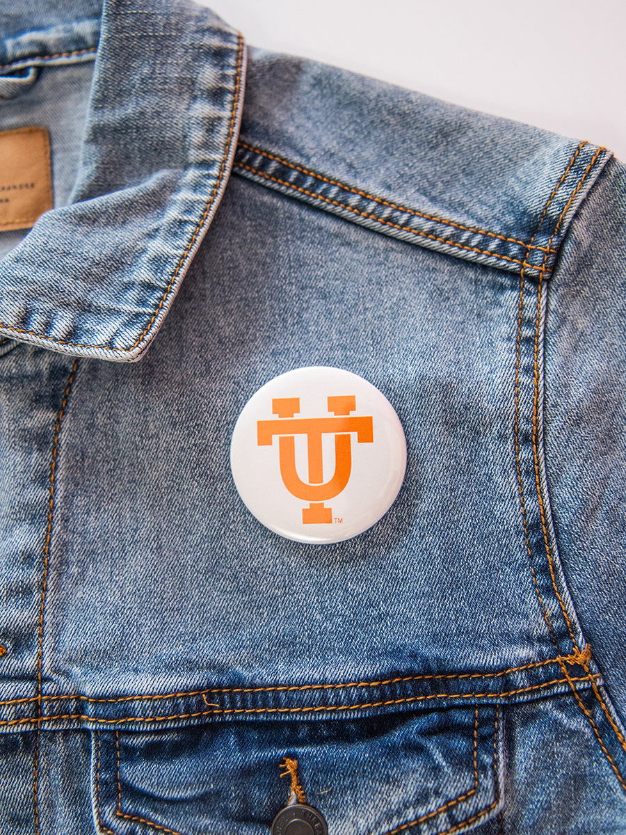 UT logo on round white button