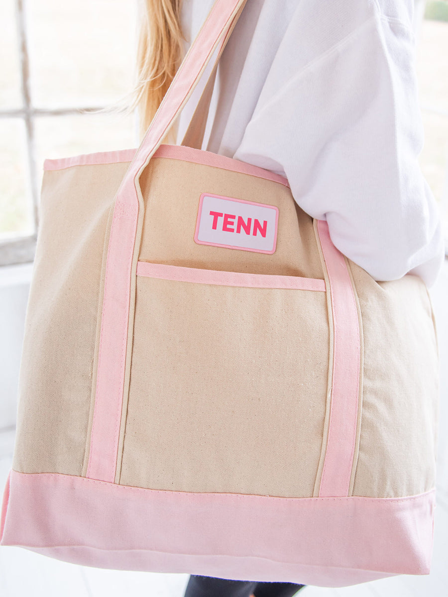 Pink accents on ivory canvas bag