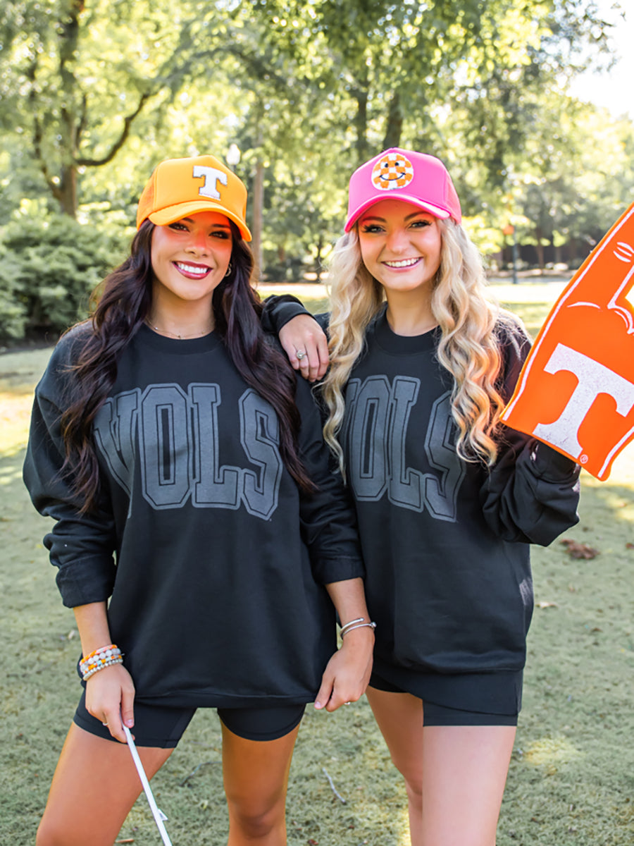 Models wearing black Vols Shirts