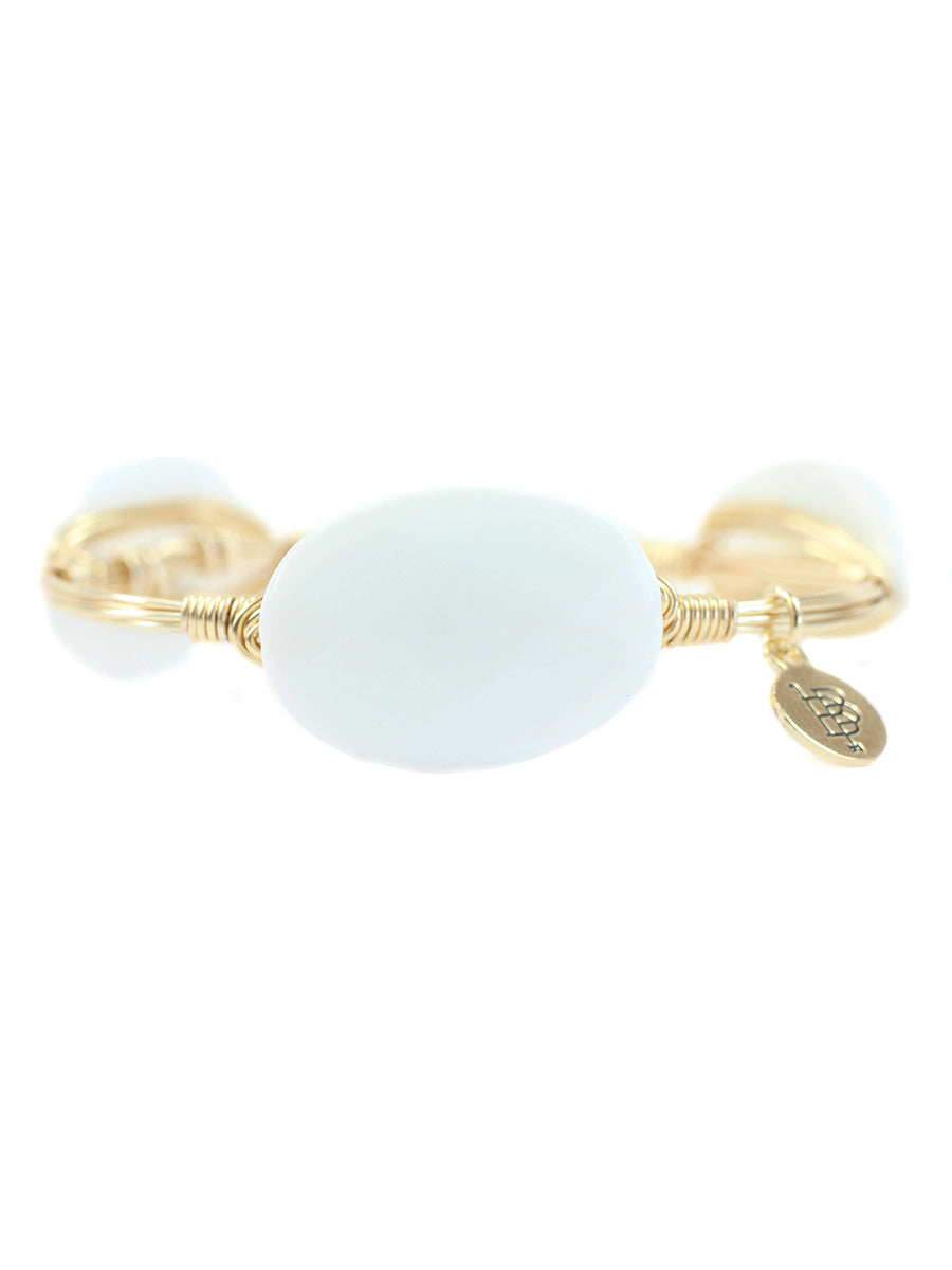 White Stone Bangle Bracelet Features Gold plated copper wire Adorned with 3 white stones Available in 2 wrist sizes
