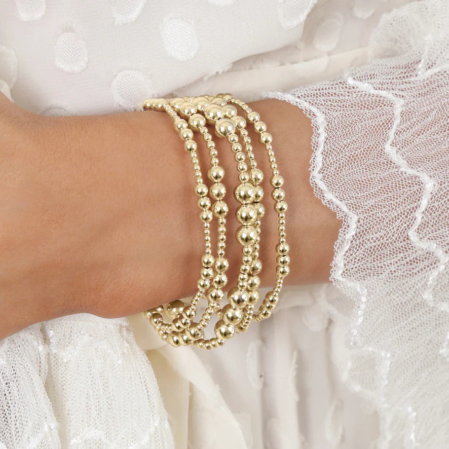 E-Newton Stack of Gold Beaded Bracelets on Model