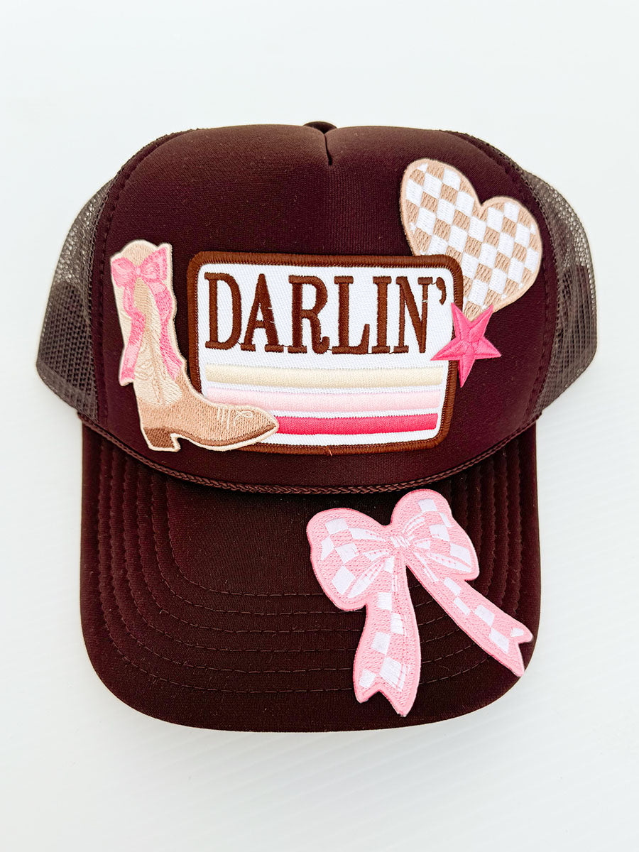 Brown trucker hat with "Darlin" patch