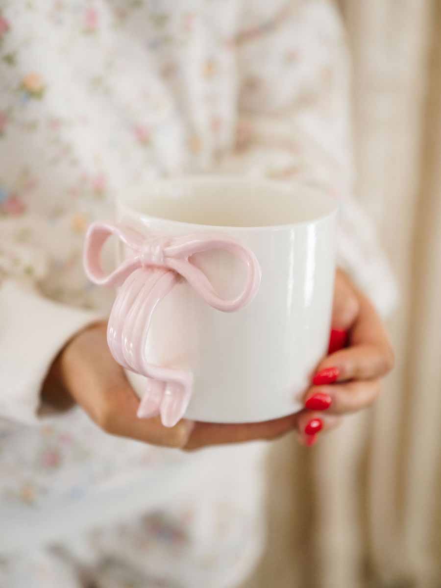 Ceramic mug with pink bow handle