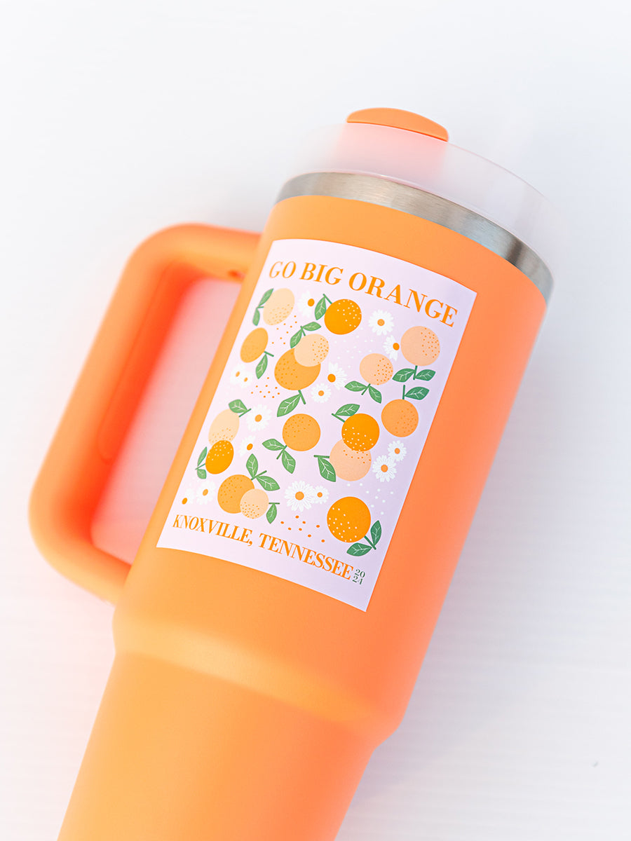 orange floral sticker on orange cup