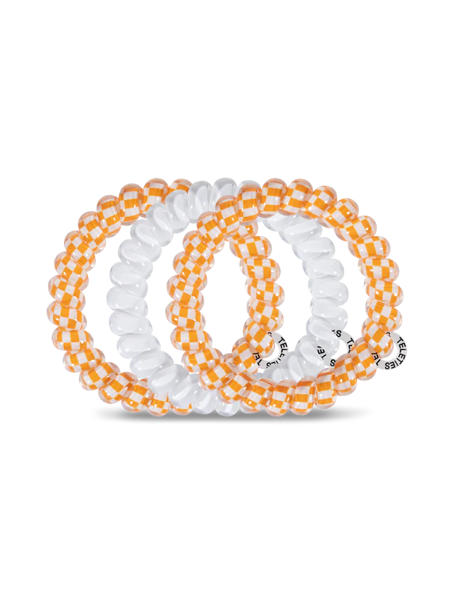 3 orange and white hair ties