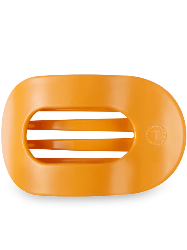 orange close up on an oval hair clip