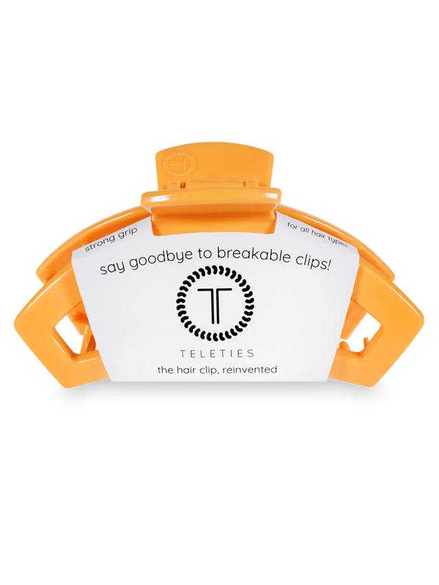orange hair clip with teleties tag