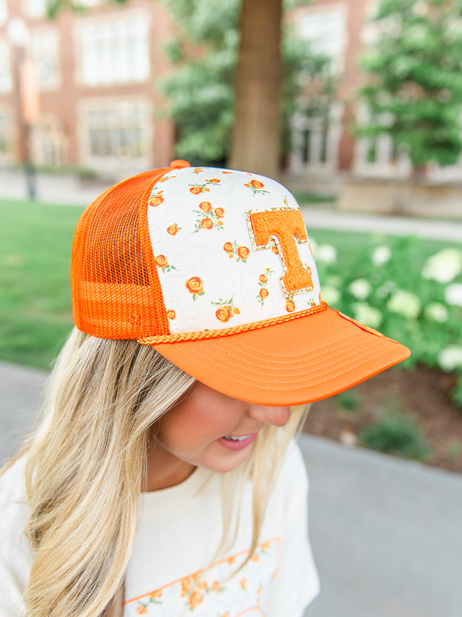 Floral Top and Orange Trucker Hat