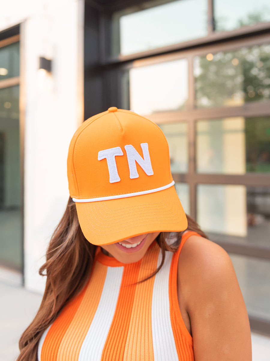 Orange hat with 'TN"