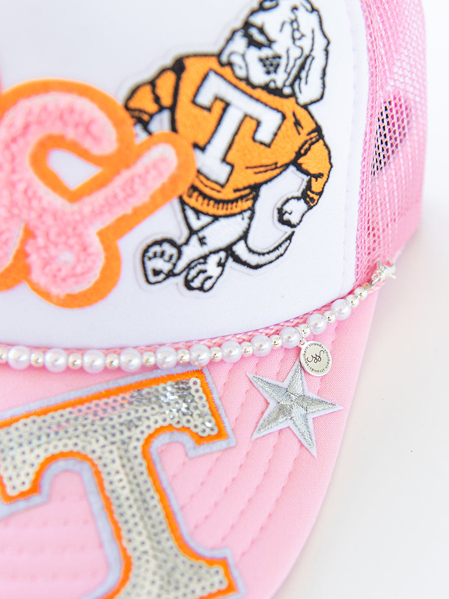 Closeup of Pink Hat with Patches and Pearl Strand