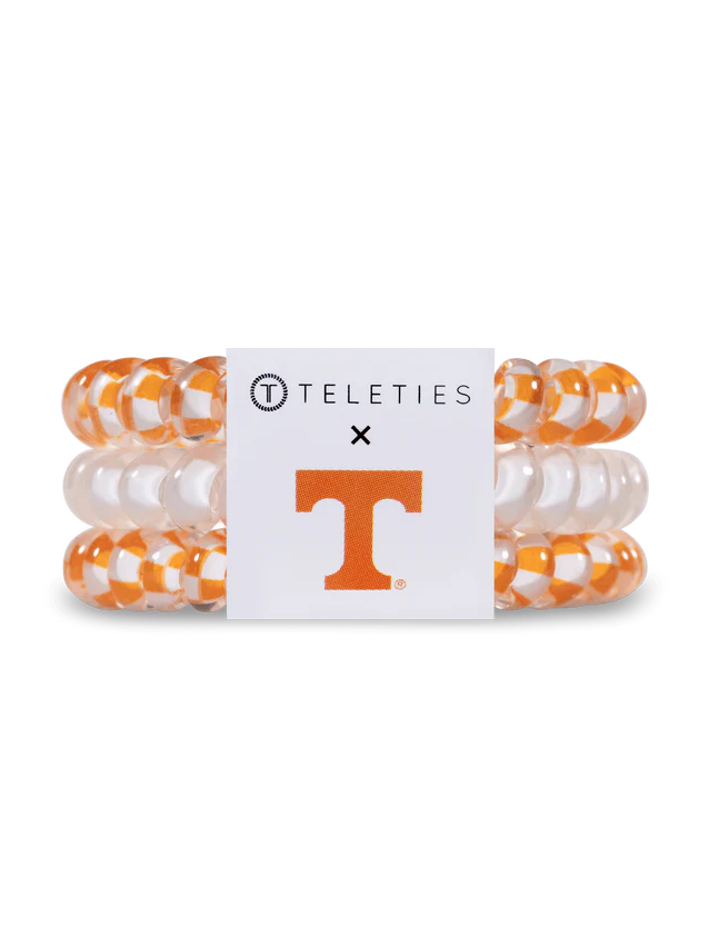 small size orange and white spiral pony tail holders with tag