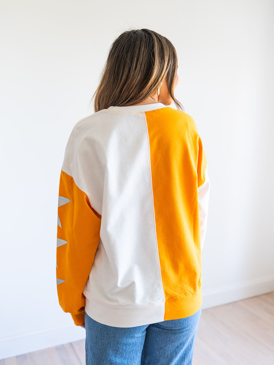 orange and white color block sweatshirt