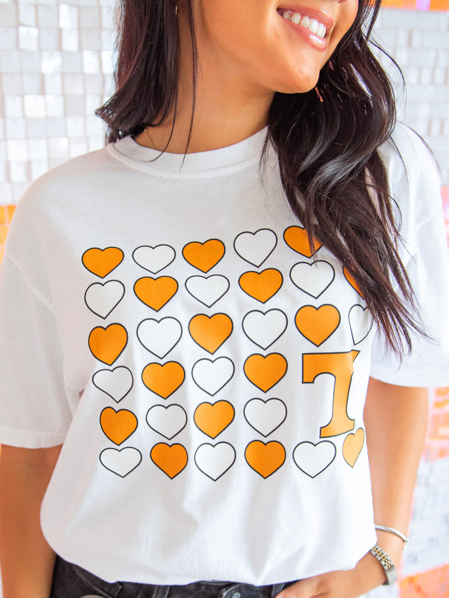 Closeup of orange hearts grid tee design