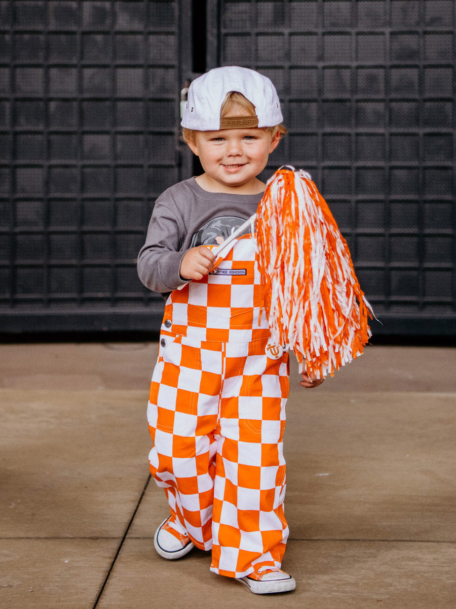 Orange fashion and white checkered overalls