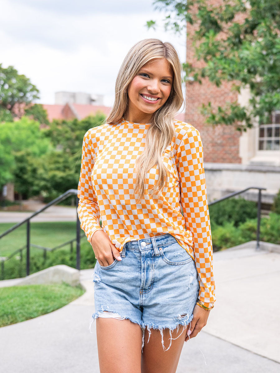 Orange and white checkered long-sleeve mesh top