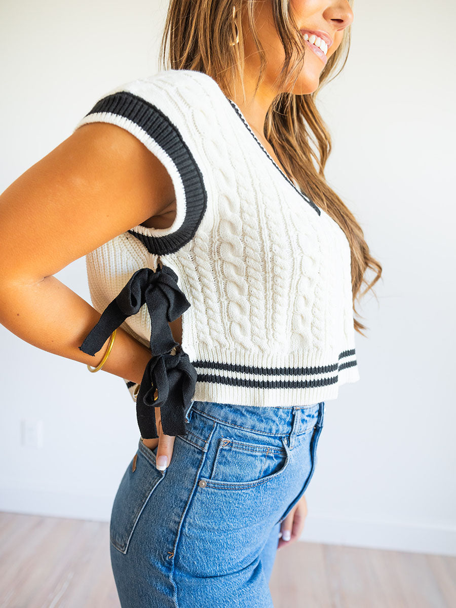 White sweater vest with side bows