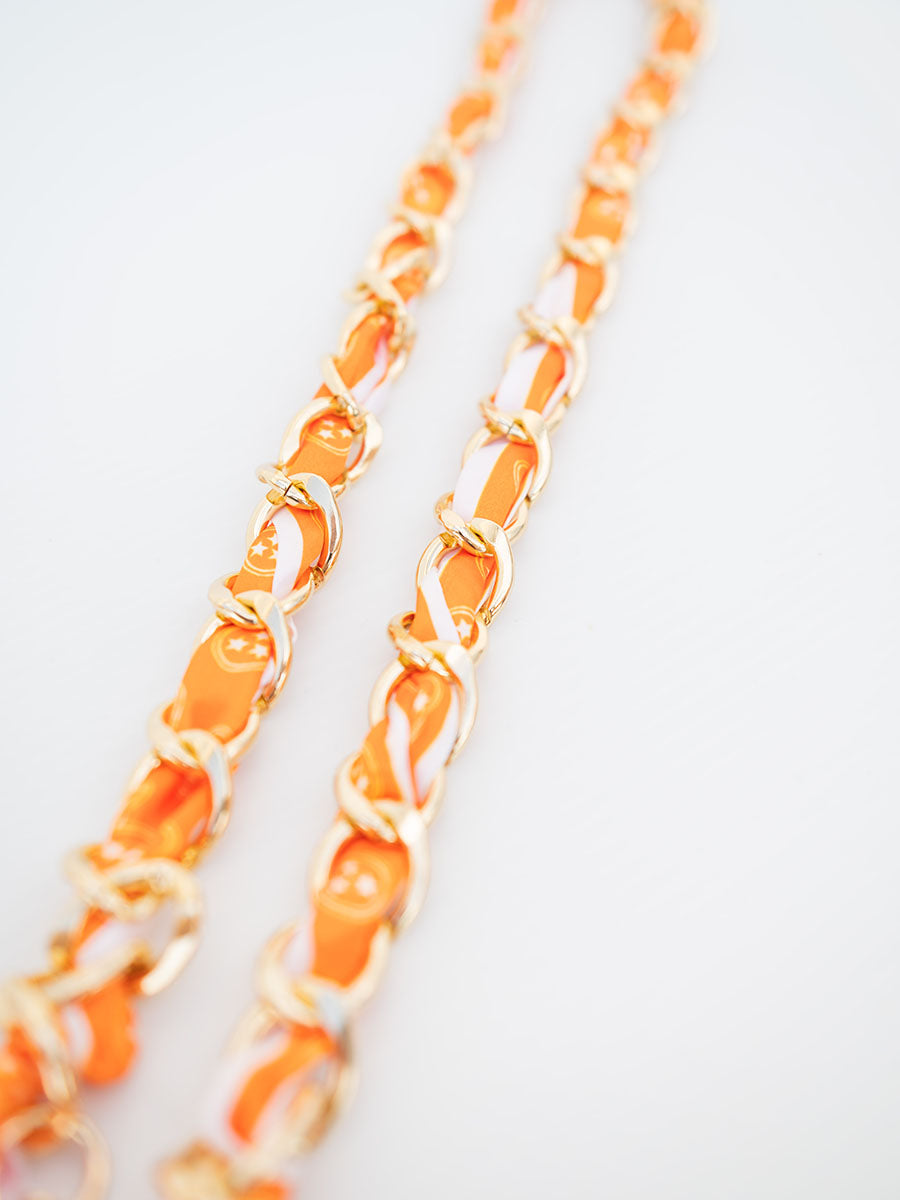 gold chain link purse strap with orange scarf