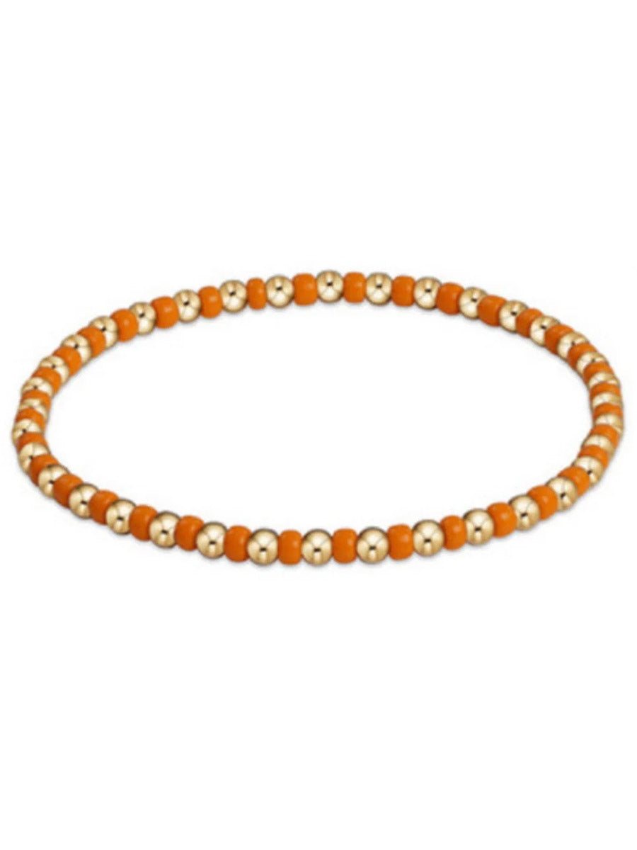 orange and gold beaded bracelet