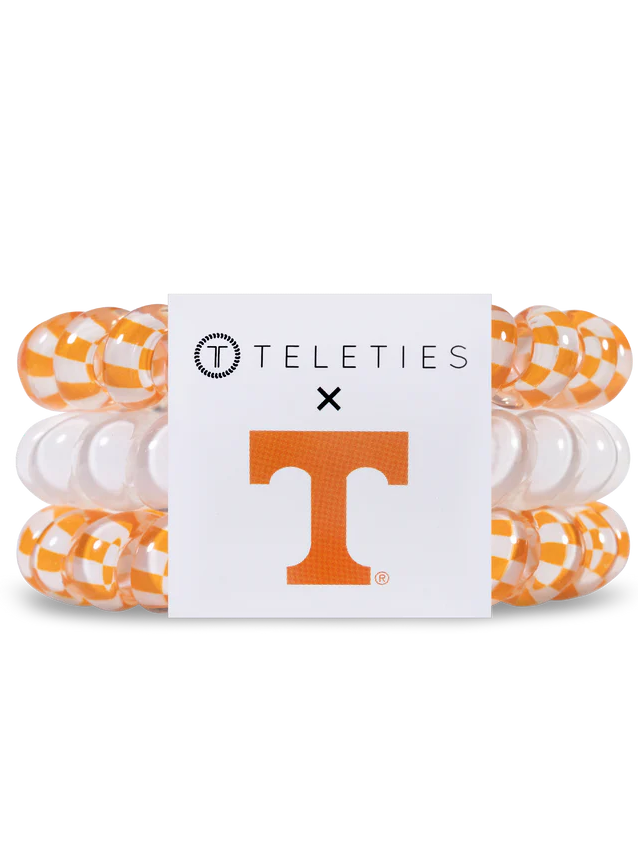 orange and white spiral hair ties with label