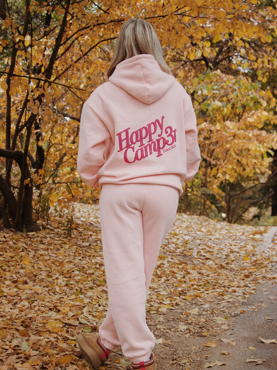 pink hoodie with Happy Camp3r on back