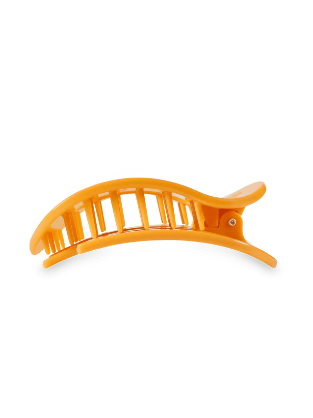 side view of an orange hair clip