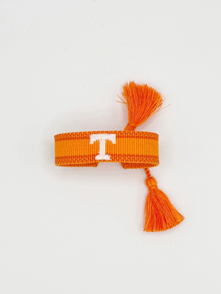 orange bracelet with "Power T"