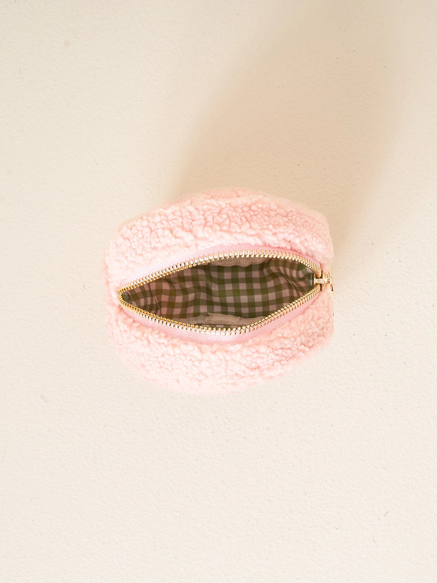 Pale pink round sherpa pouch