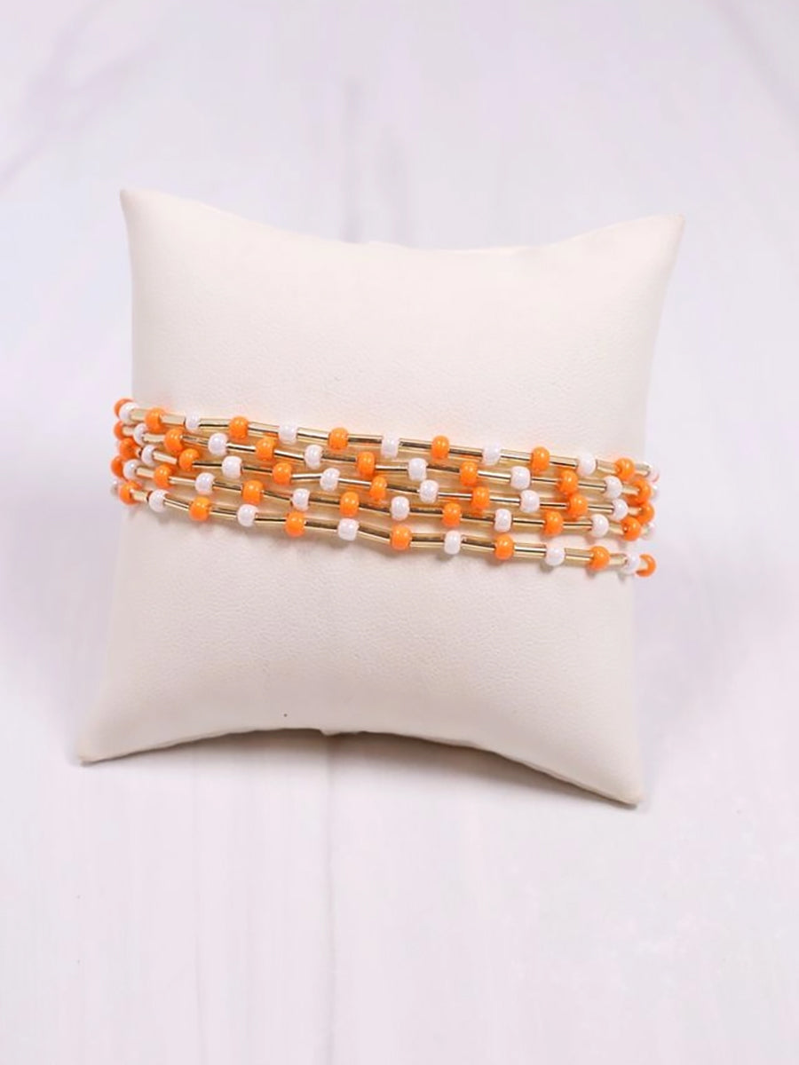 orange and white beaded bracelet set