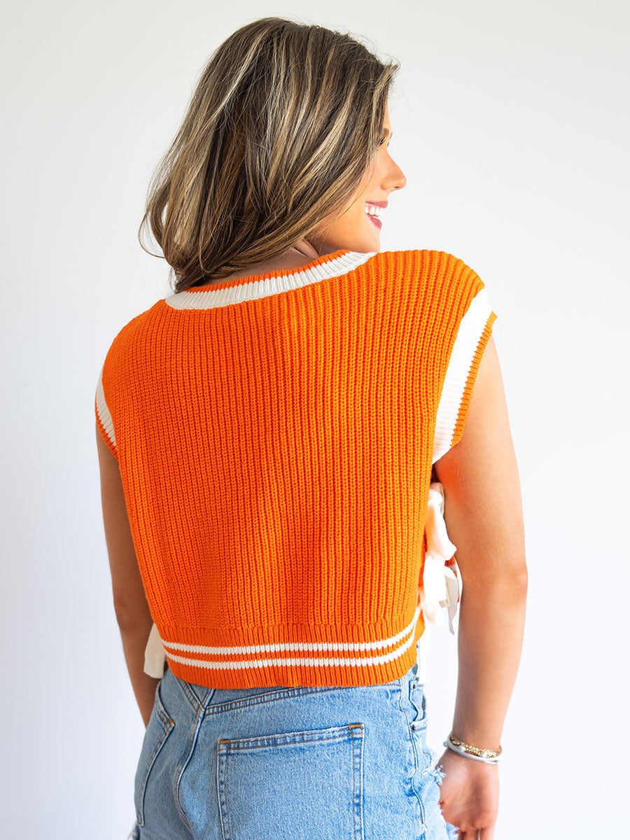 Back of Orange and White Sweater Vest