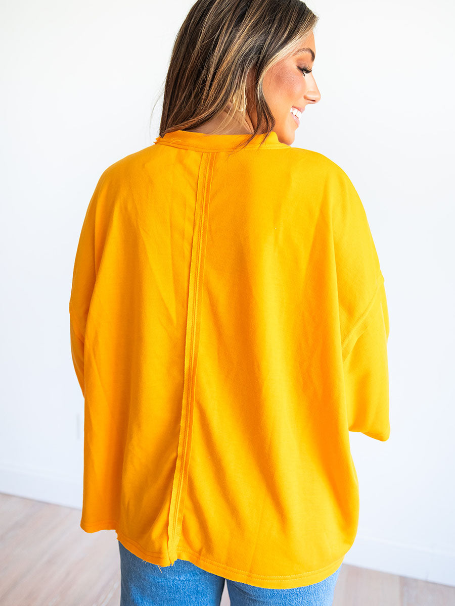 Orange top with vertical back seam