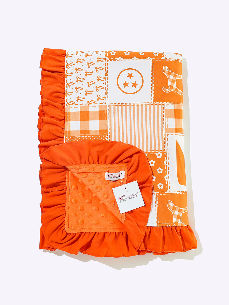 Orange and white patchwork baby blanket