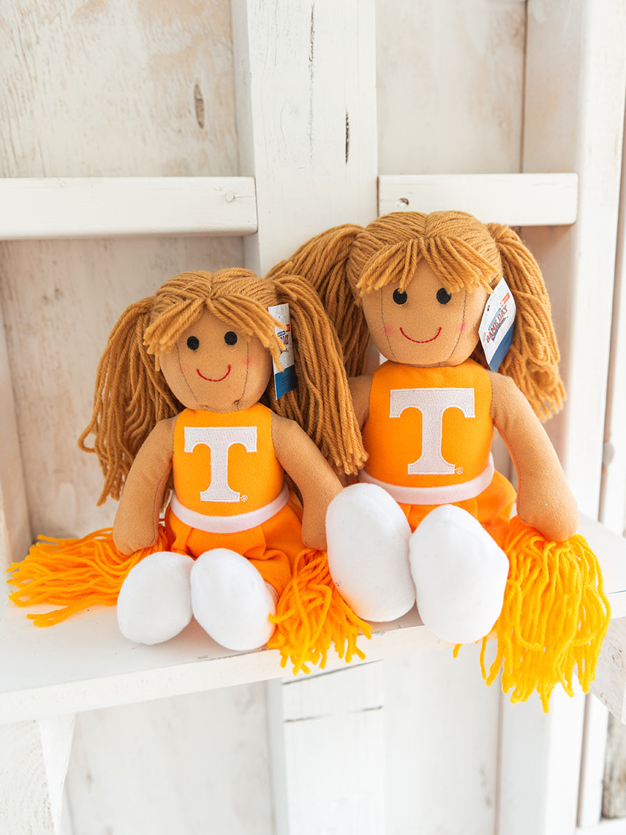 Plush cheerleader dolls in orange with a Power T