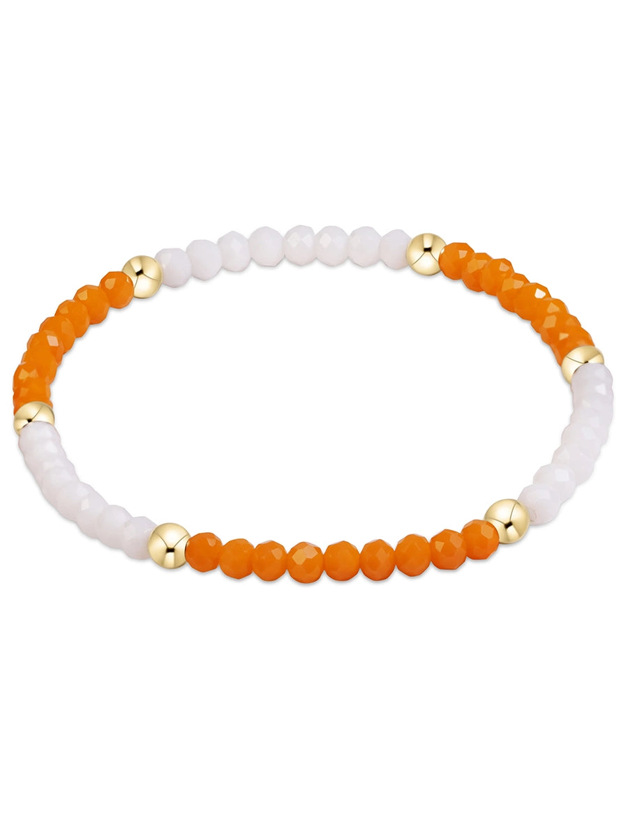 Orange, white and gold bead bracelet
