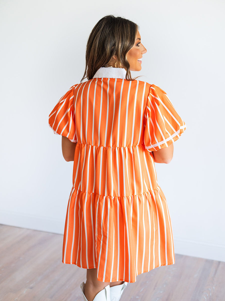 Orange and white dress with sequined collar