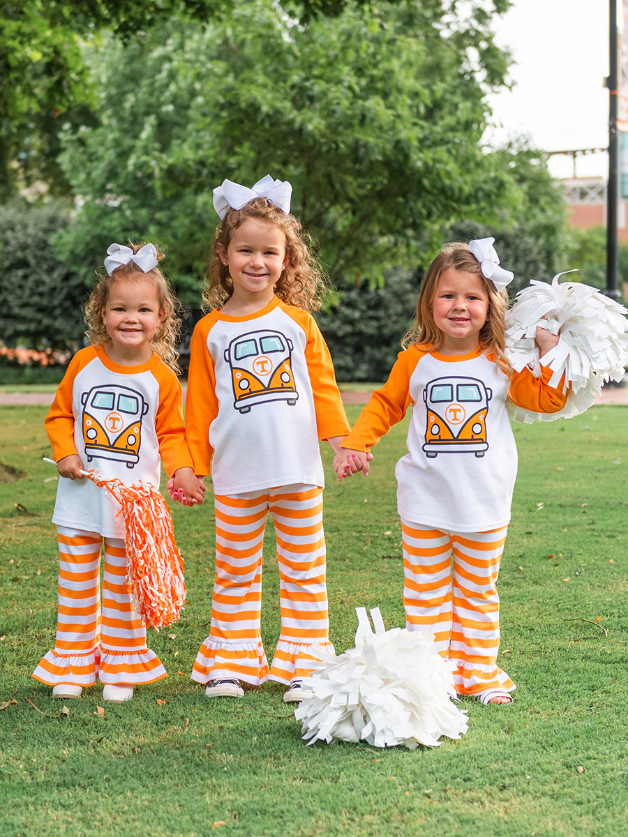 3 girls wearing orange and white raglan tees