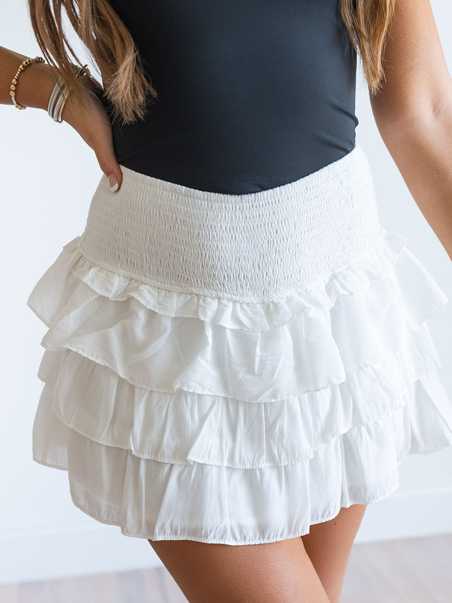 White ruffled mini skirt