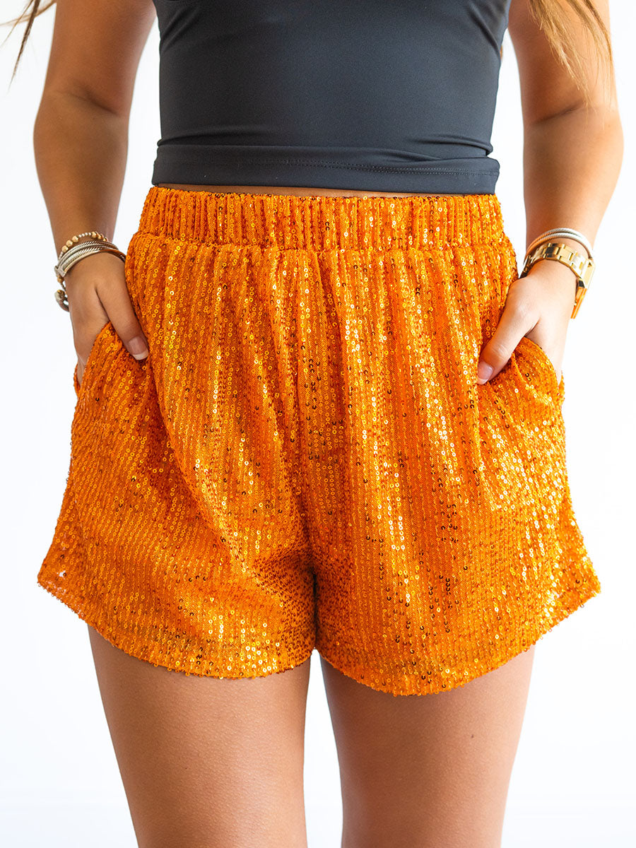 Orange sequin shorts with pockets