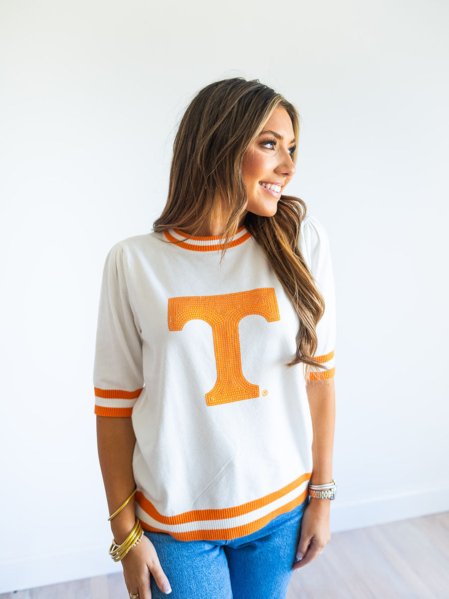 Cream and orange stripe sweater with "Power T"