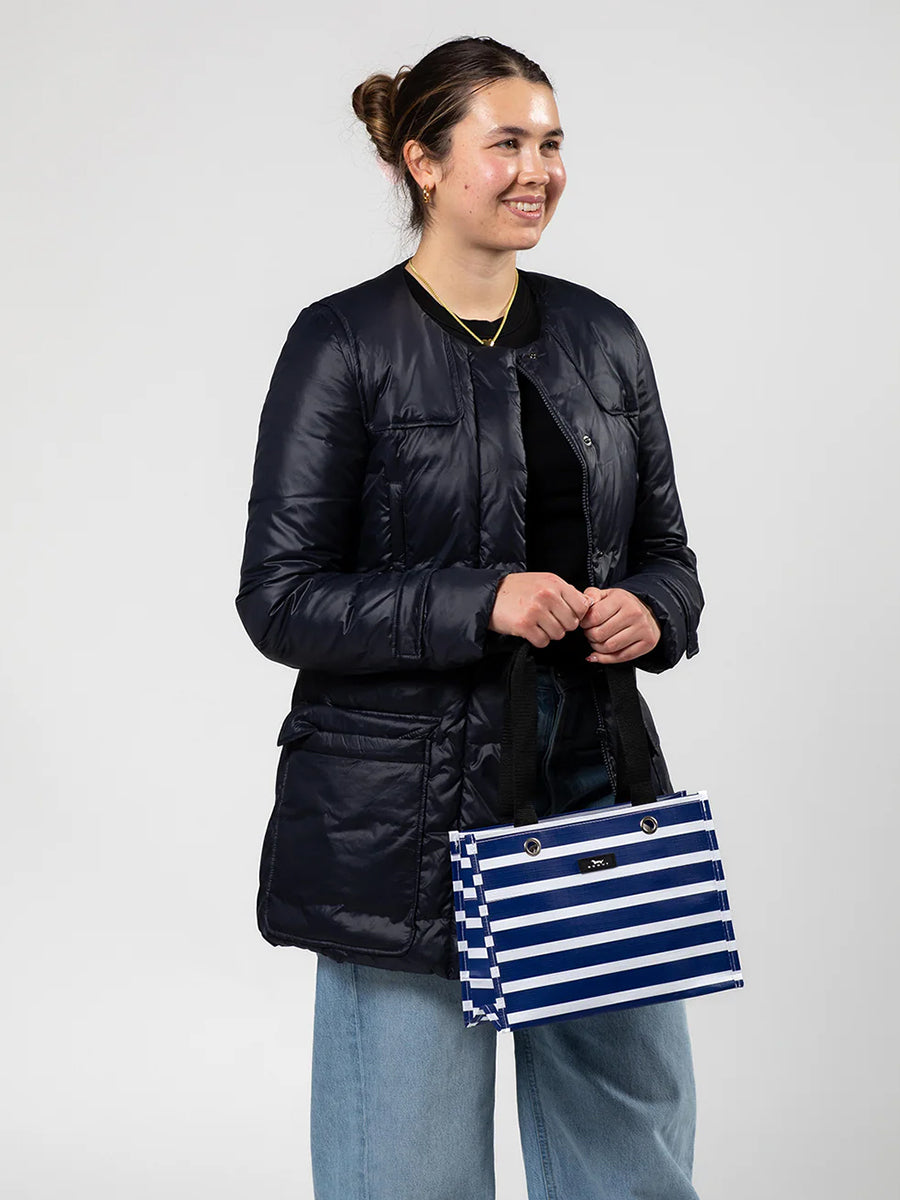 Woman Holding Scout Navy Striped Gift Bag