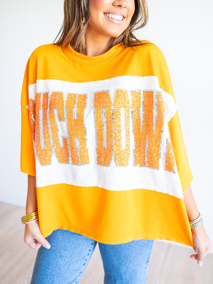 Sequin touchdown top in orange and white