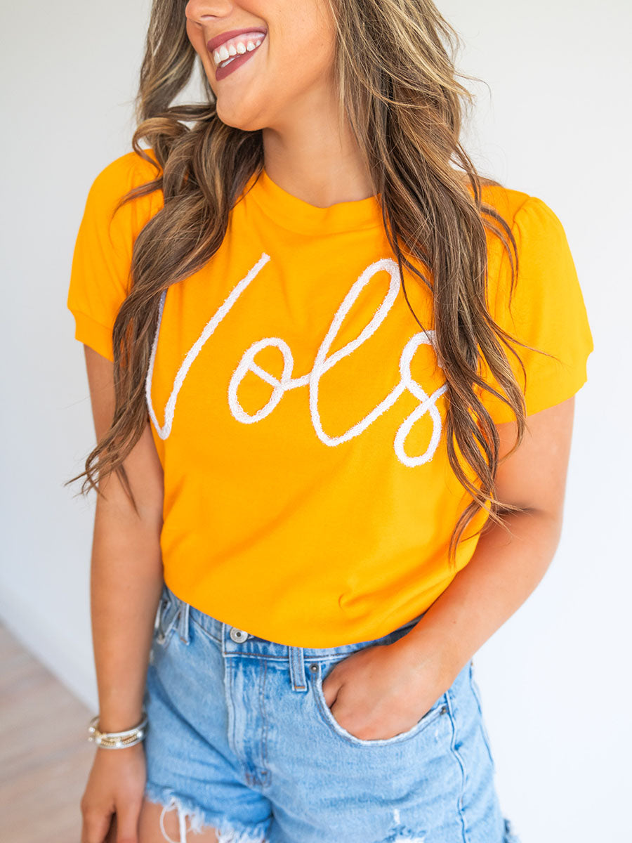 Orange top with Vols script