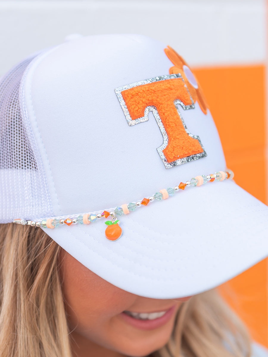 white trucker hat with orange power T