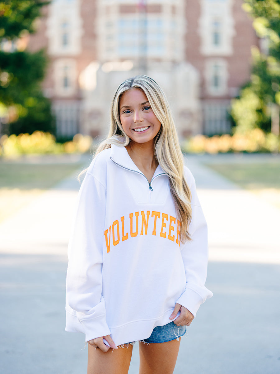 White quarter-zip VOLUNTEERS pullover